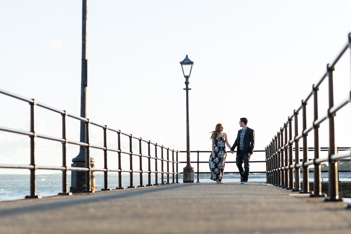 couple-walking-on-pier
