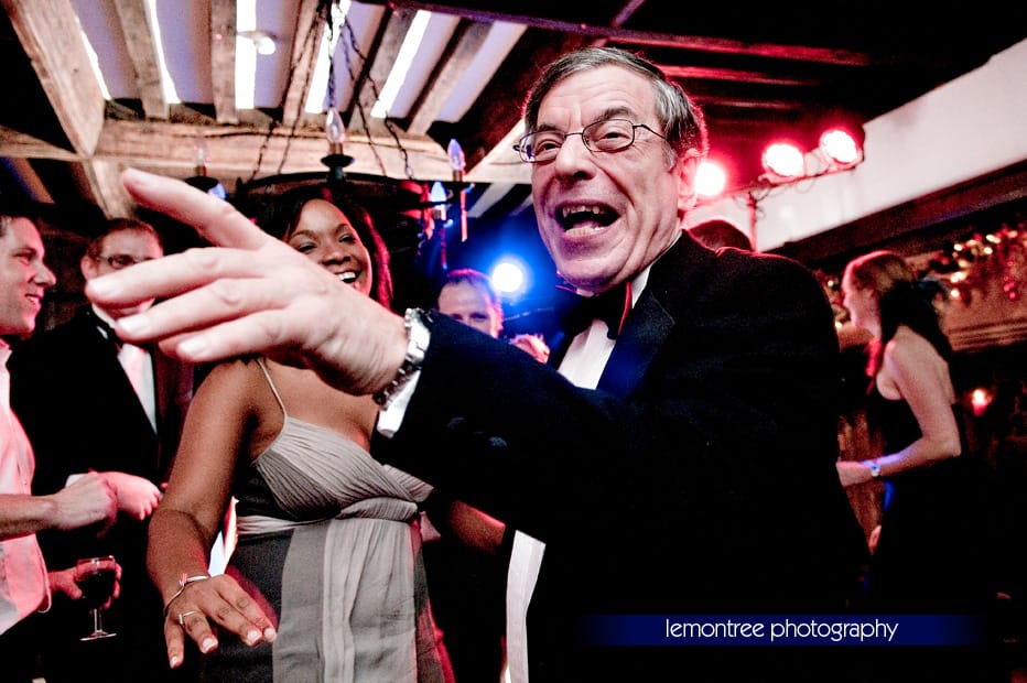 Martin's Father on the dancefloor dancing at wedding reception by New Forest Photographer