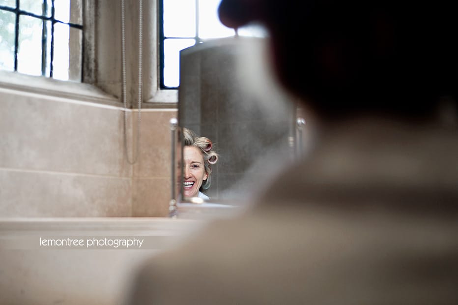 Alison getting ready for wedding at Rhinefield House Hotel Bride applying make-up before wedding