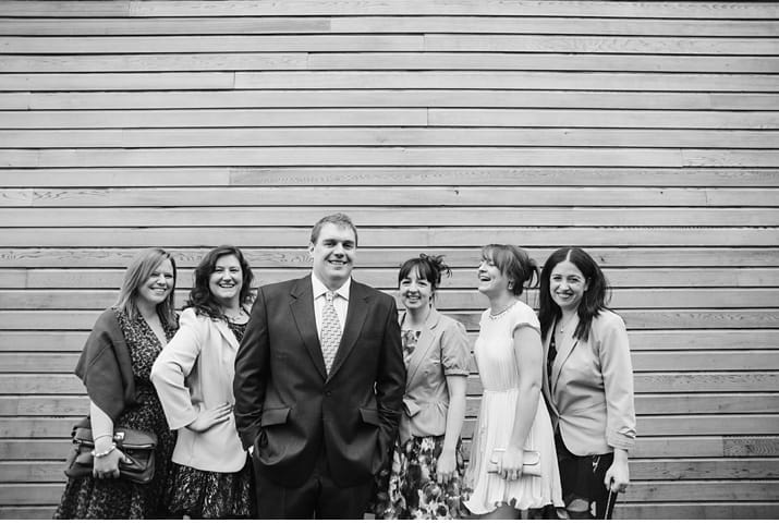 guests posing for wedding pphotographs