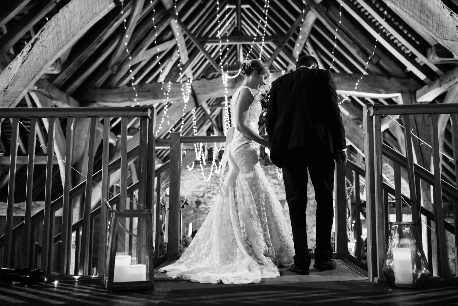 Bride and groom descending staircase
