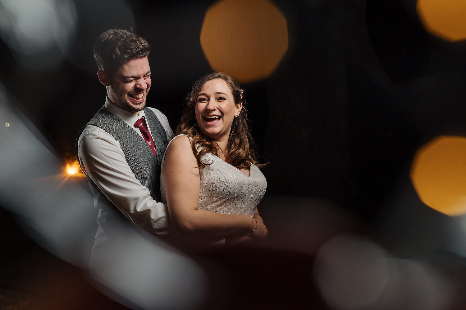 bride and groom laughing at careys manor wedding