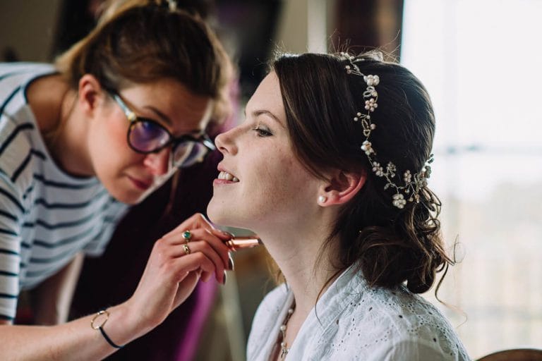 bride getting make up at froyle park
