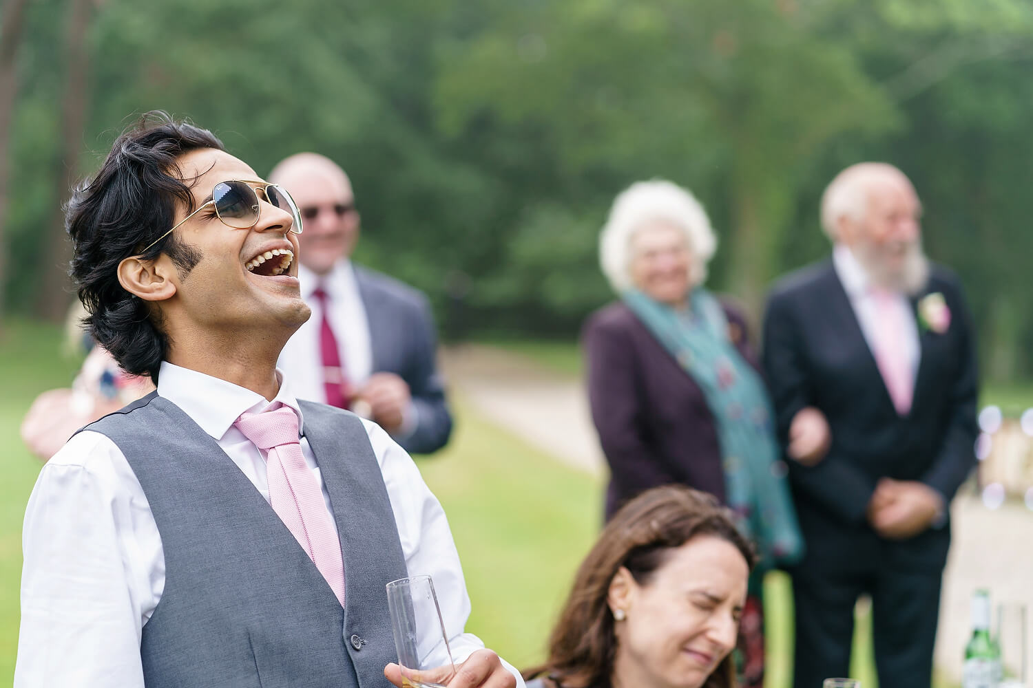 guest laughing at wedding