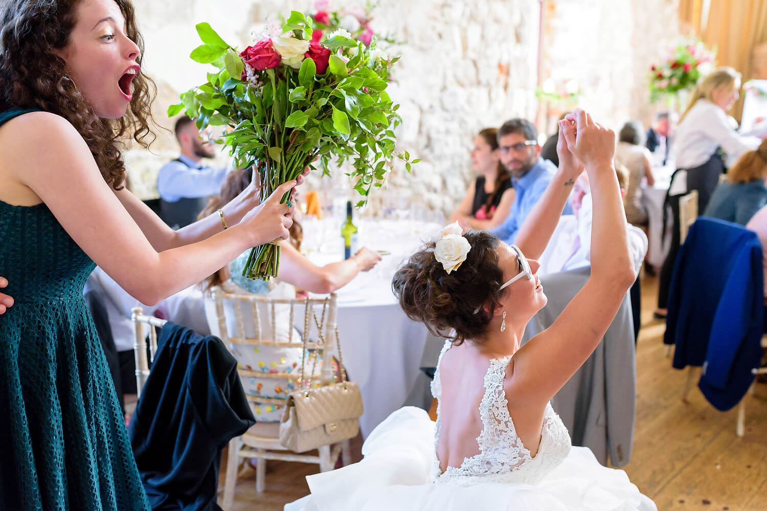 wedding guest catching bouquet