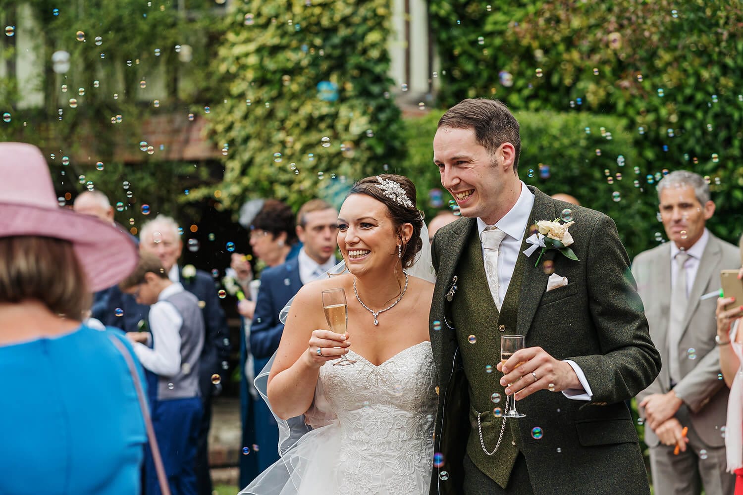 bride and groom laughing at surrey wedding