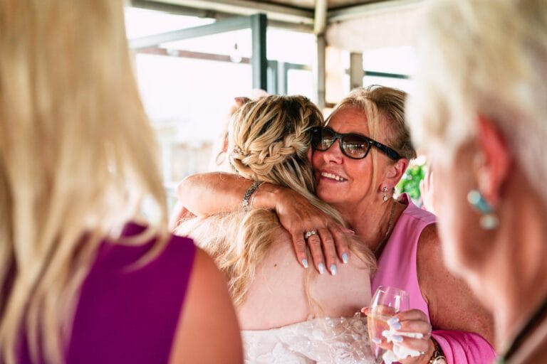 wedding-guest-embracing-bride