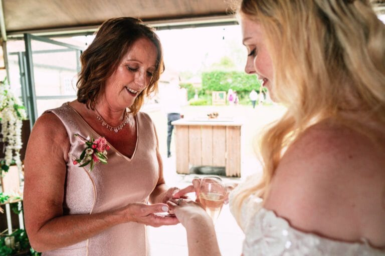mother-looking-at-brides-wedding-ring