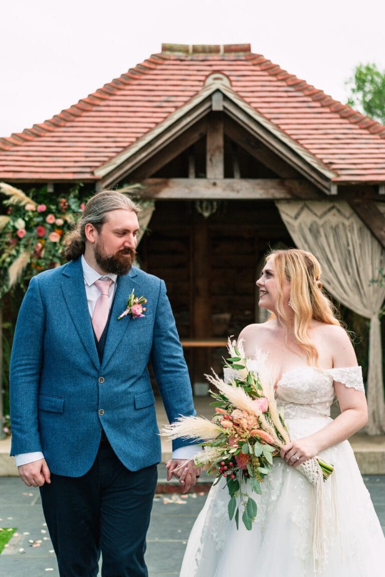 bride-and-groom-walking-at-southend-barns