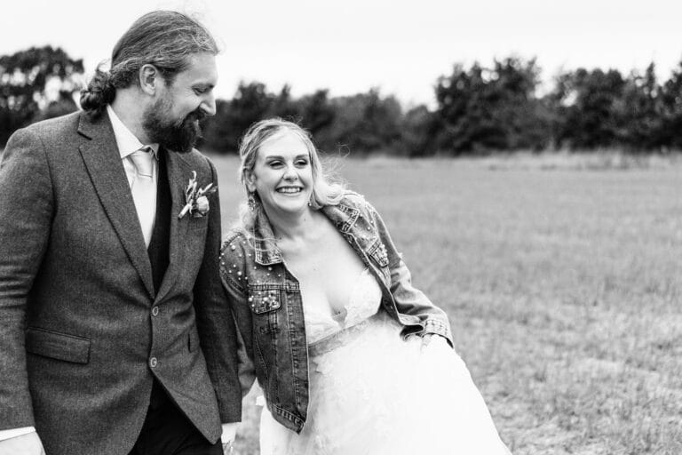 bride-and-groom-on-field-southend-barns